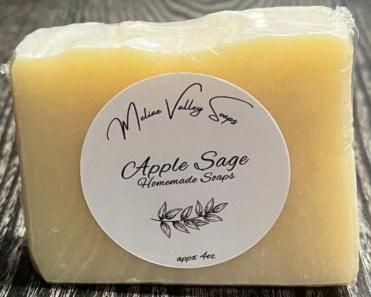 Bar of uncolored soap on a wooden surface with a white label.