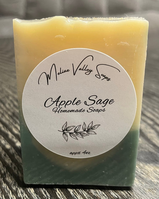 Bar of soap with a white label on a wooden surface.
