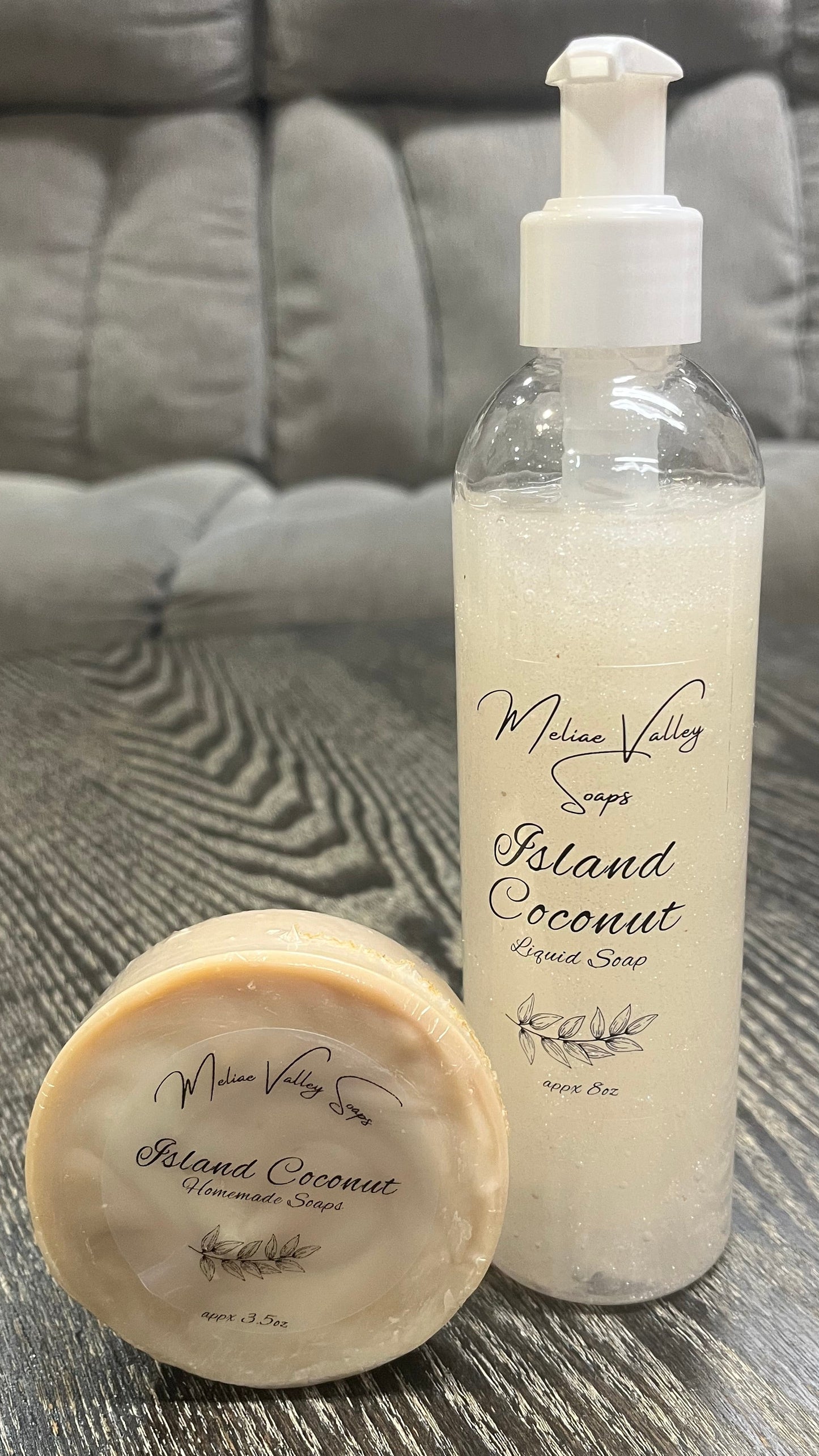 A set of beauty products, including a bottle and a bar on a textured surface.