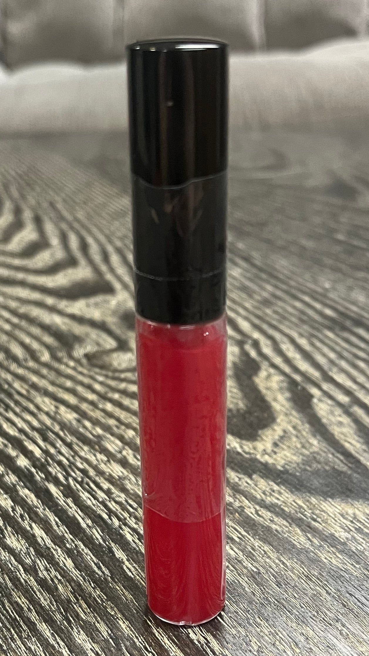 Red tube of lip gloss.