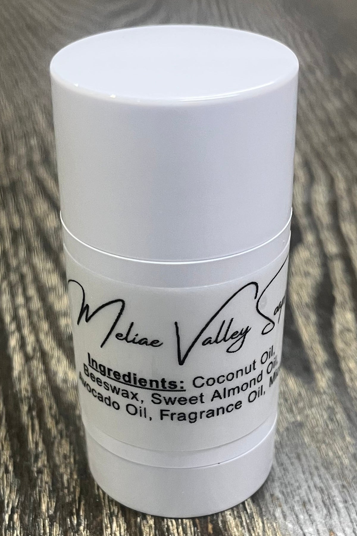 A white tube with an ingredients label on the back.