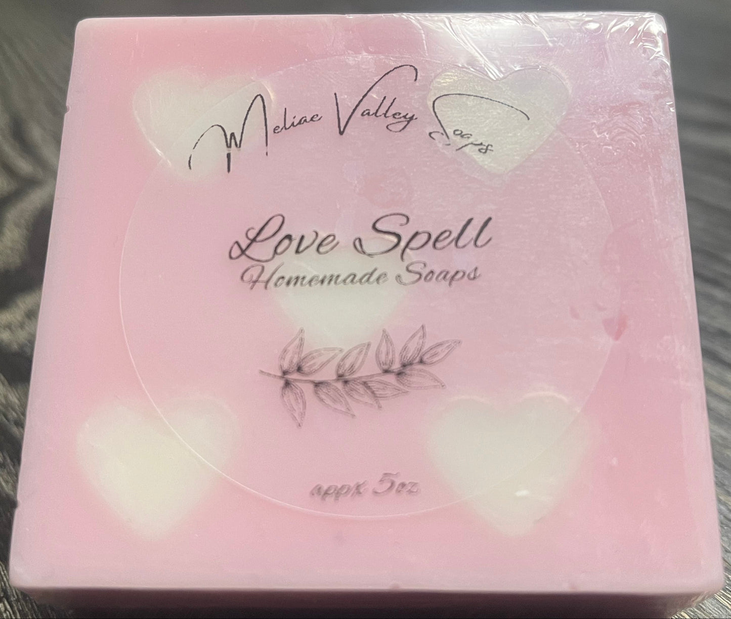 Pink soap bar with white heart embeds.
