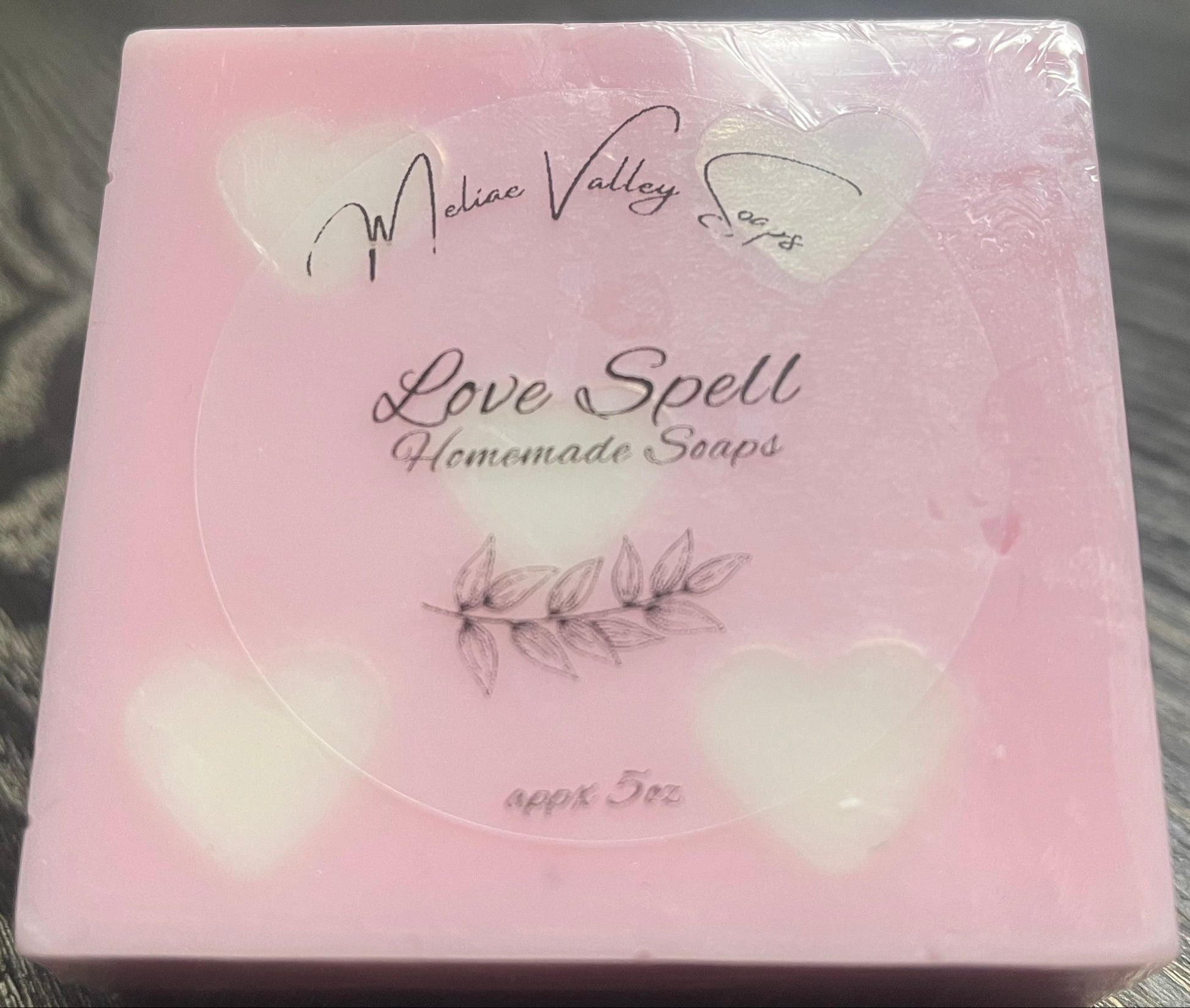 Pink soap bar with white heart embeds.