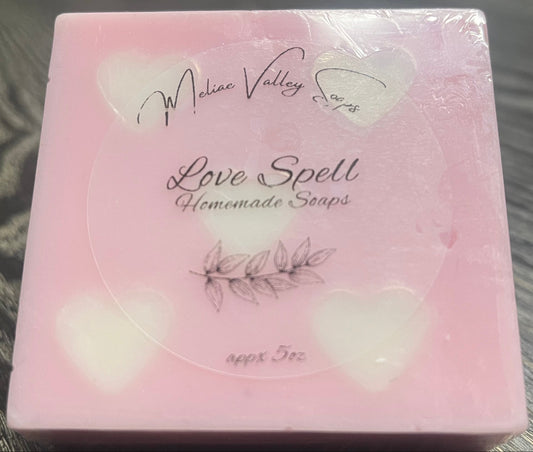Pink soap bar with white heart embeds.