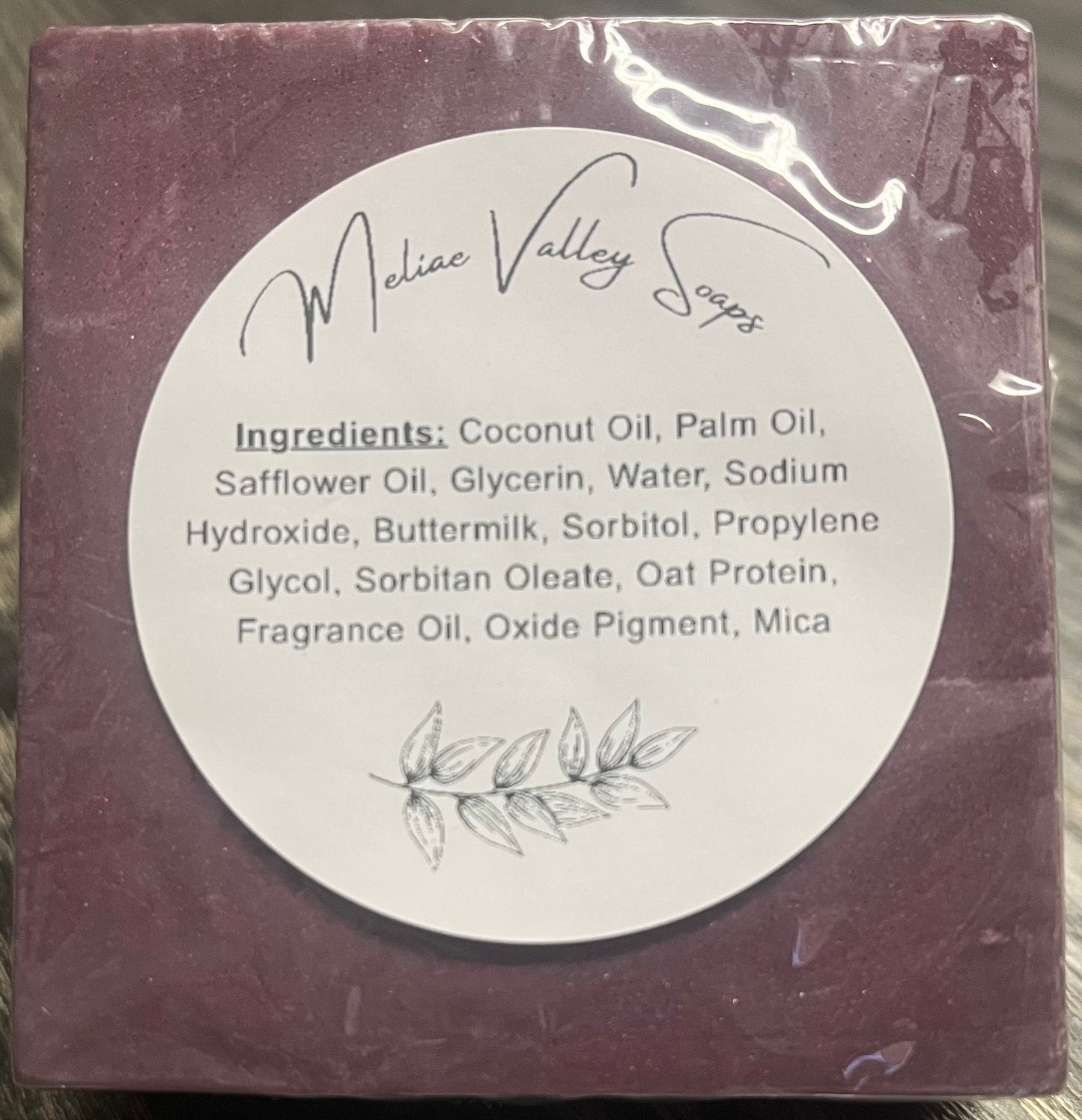 Purple soap bar with an ingredients label.