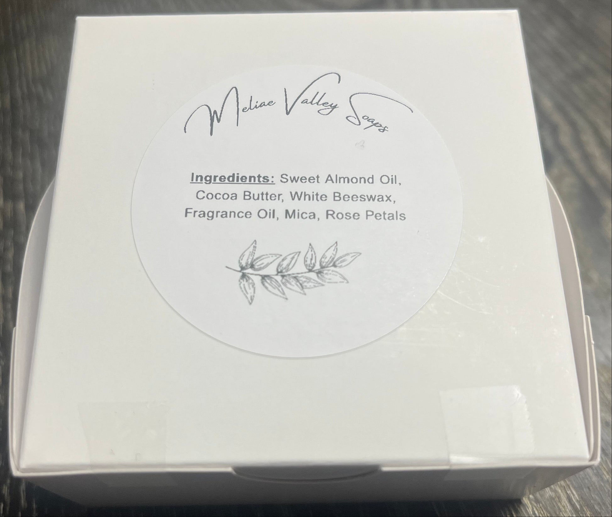 White product packaging with ingredients.