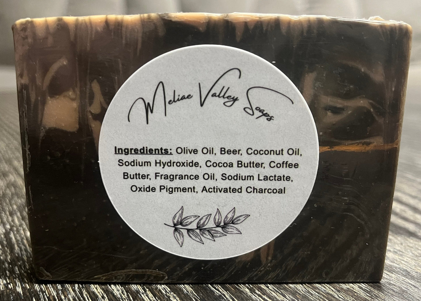 Bar of soap with a white ingredients label.