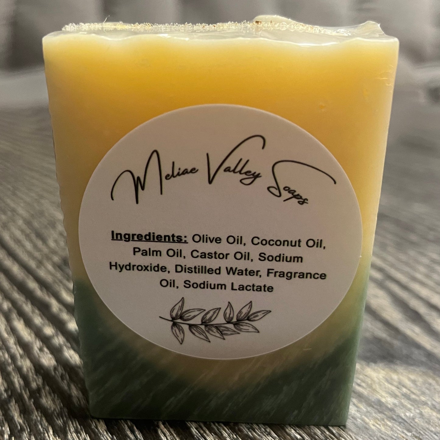 Bar of soap with a white ingredients label. 