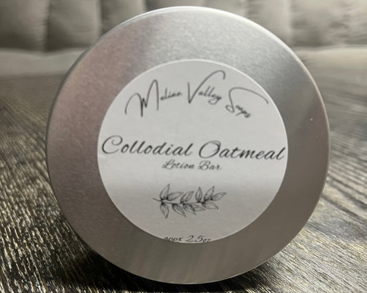 Colloidal Oatmeal lotion bar tin with label on a textured surface