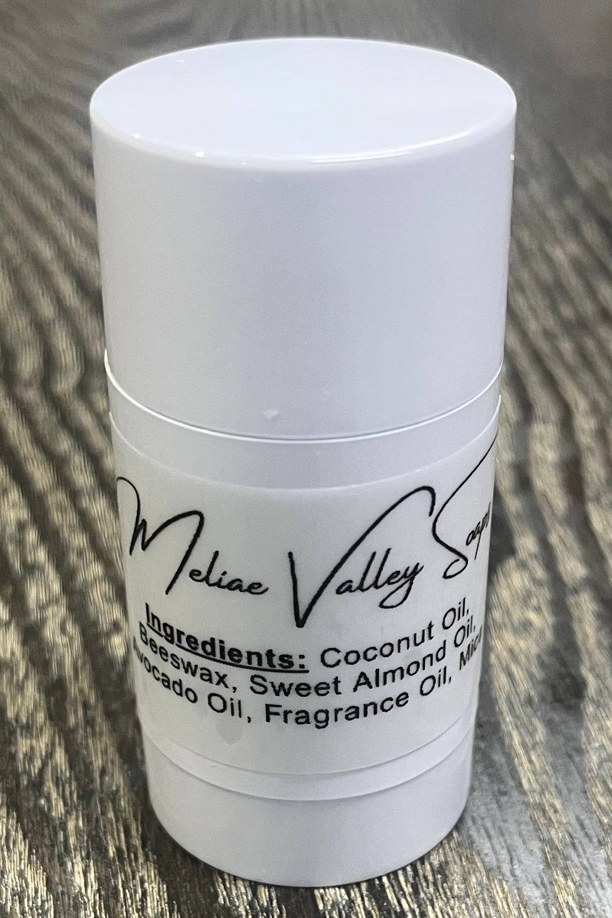 A white tube with an ingredients label on the back. 