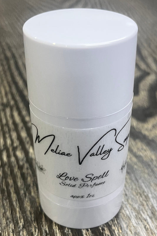 A white tube with a label on the front. 
